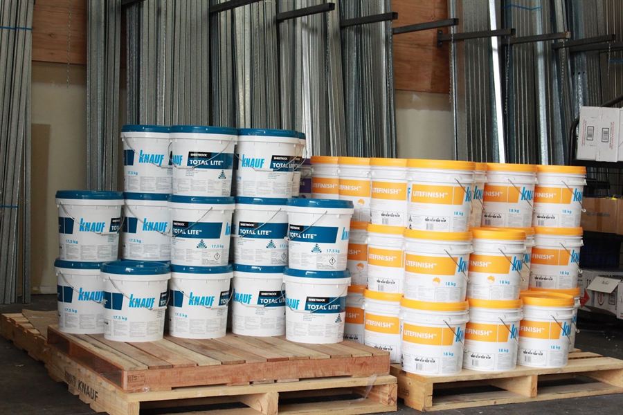 Knauf compound and adhesive pails on pallets