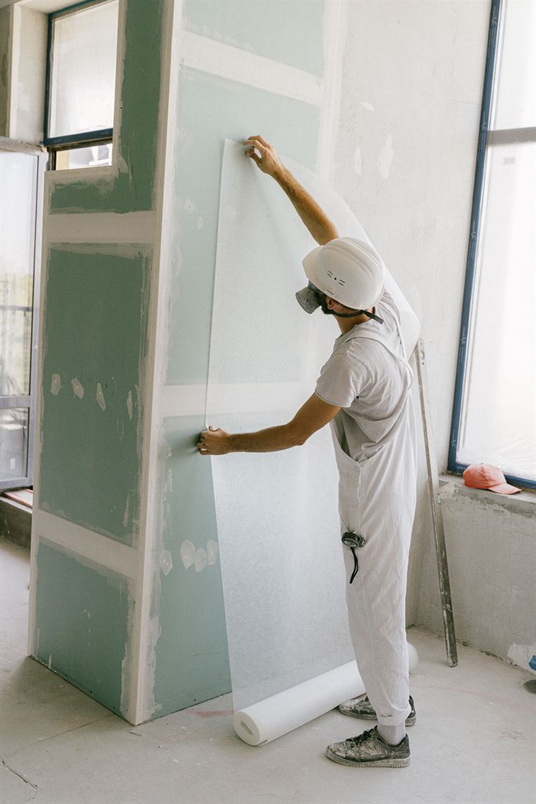 Plasterboard sheets being handled in the Bayside Plasterboard yard